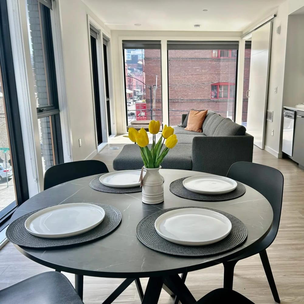 Dining area with connecting kitchen and living space at DOCK 59 in Portland, Oregon