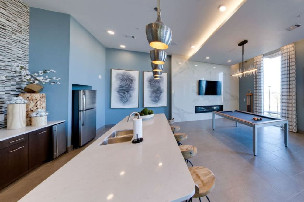 Resident game room with kitchen and billiards table at Argon in Oklahoma City, Oklahoma