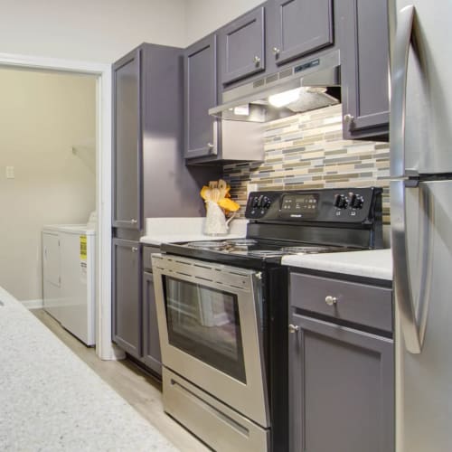 Stainless-steel appliances in an apartment kitchen at Villas at Princeton Lakes in Atlanta, Georgia