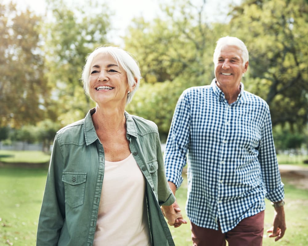 A couple walks the grounds at Arlington Place of Grundy Center in Grundy Center, Iowa.