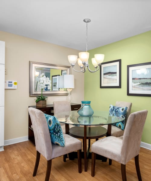 Dining room with wood-style flooring at Columbus Station Apartments at Town Center, Virginia Beach, Virginia