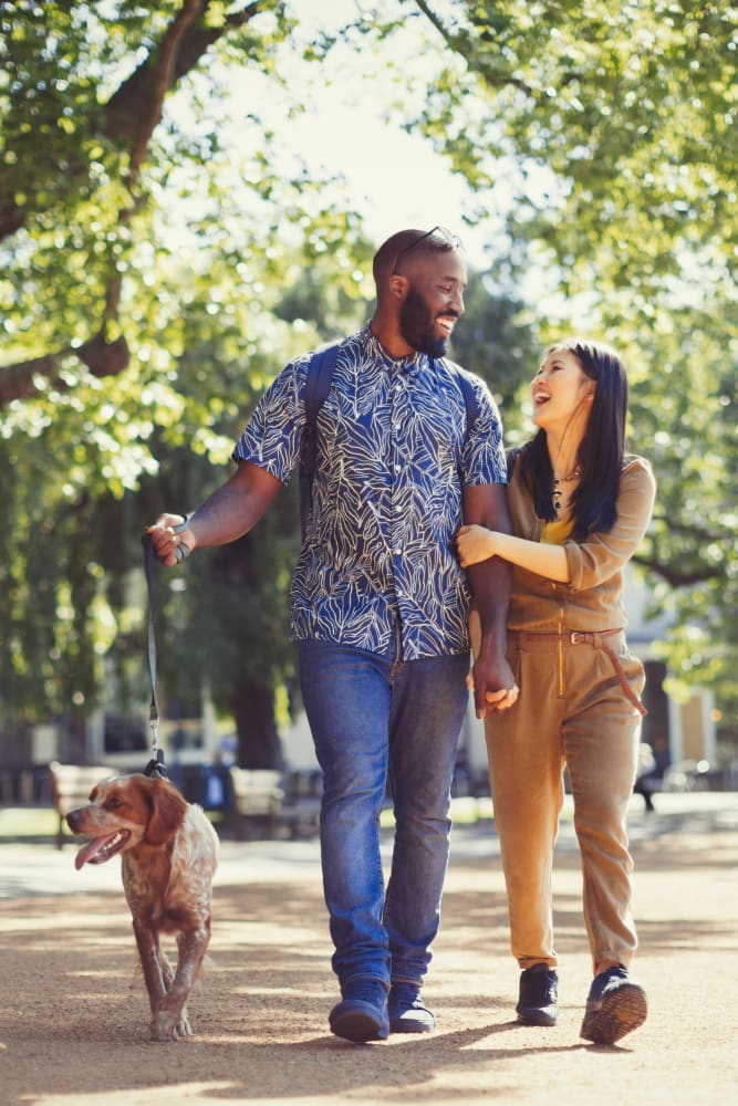 Residents walking their dog at 300 Optimist Park in Charlotte, North Carolina