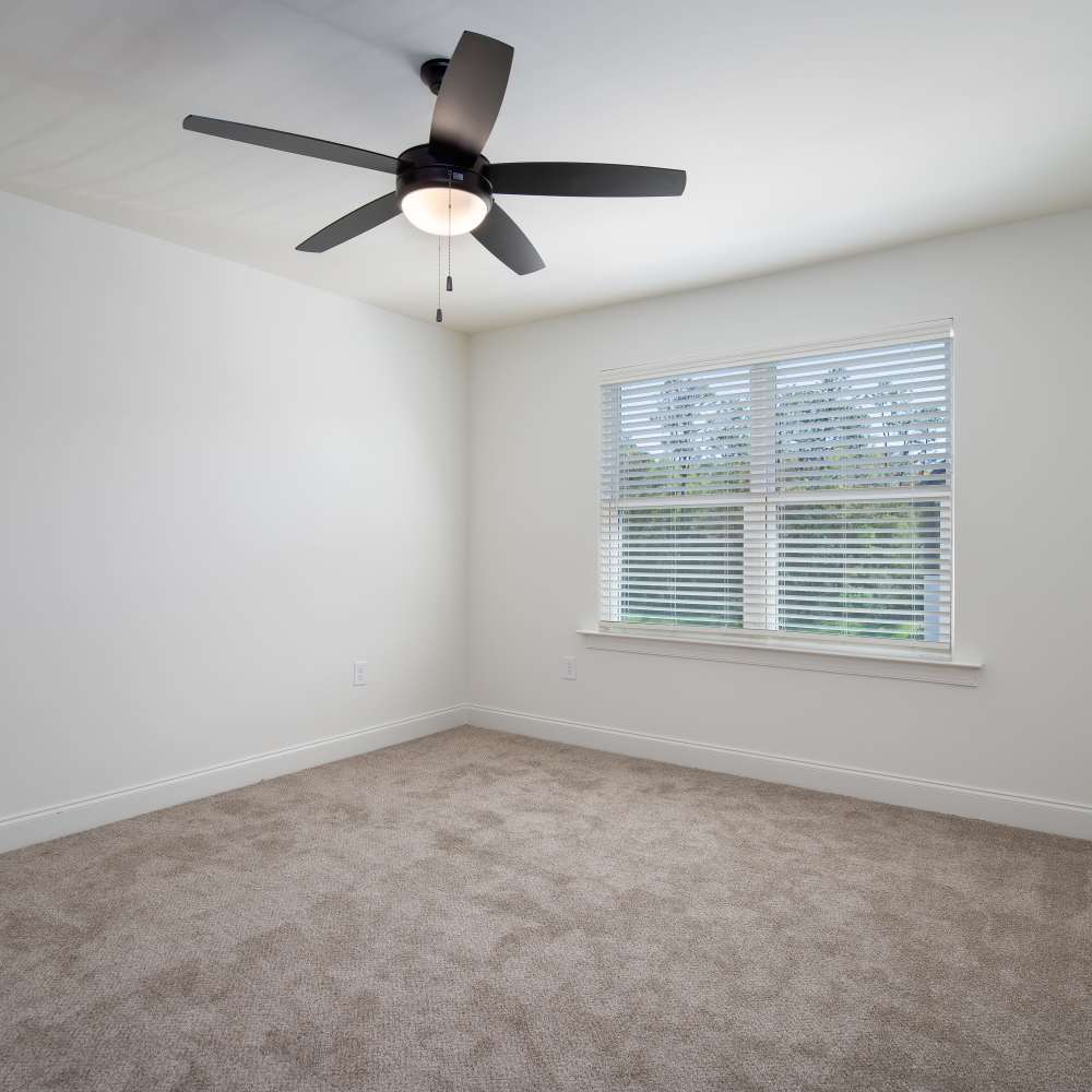 Unfurnished master bedroom with a window at Retreat at Redstone in Crestview, Florida