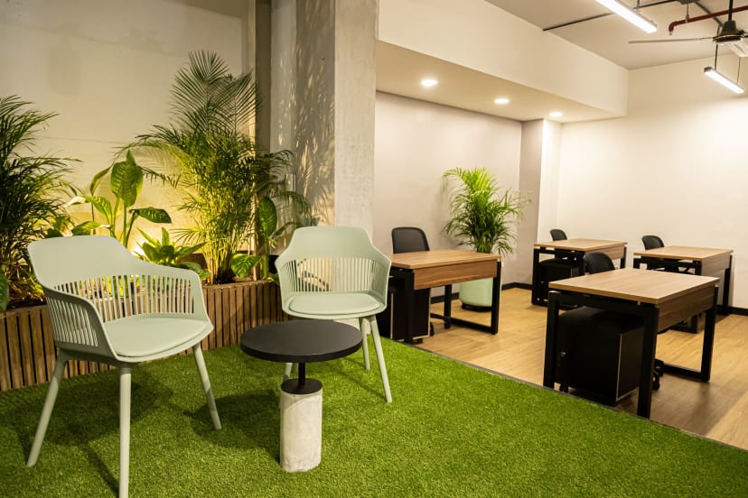 Dedicated desk in common area at be together coworking | Gable