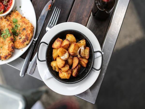 Order OVEN ROASTED GARLIC & ROSEMARY POTATOES Online - Rococo Acland