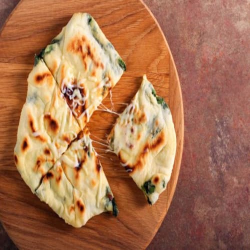 Order VEGETARIAN PIZZA NAAN Online - The Varsace Restaurant & Cafe