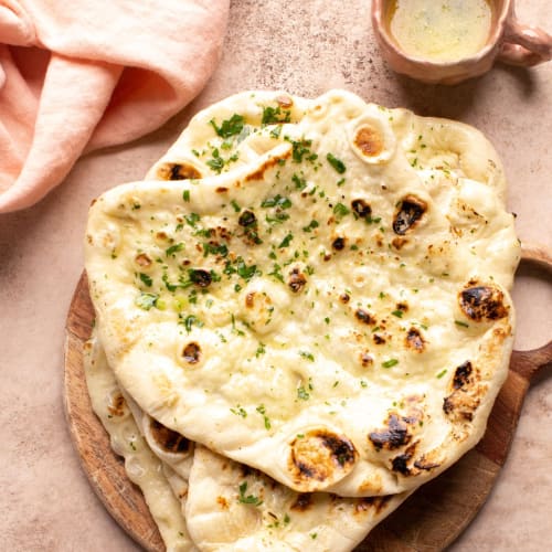 Soft Tandoori Naan Bread Brushed with Butter | Dawat The Invitation