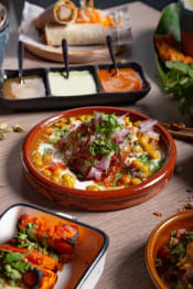 Hosting an Indian Feast? How to Pair Biryani & Butter Chicken with Pizza Origin's Fast Delivery for Large Gatherings