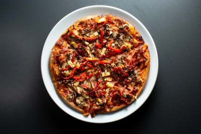 The Art of Gourmet Pizza: Balancing Flavors in Veg and Non-Veg Toppings | Amici Restaurant Pizzeria