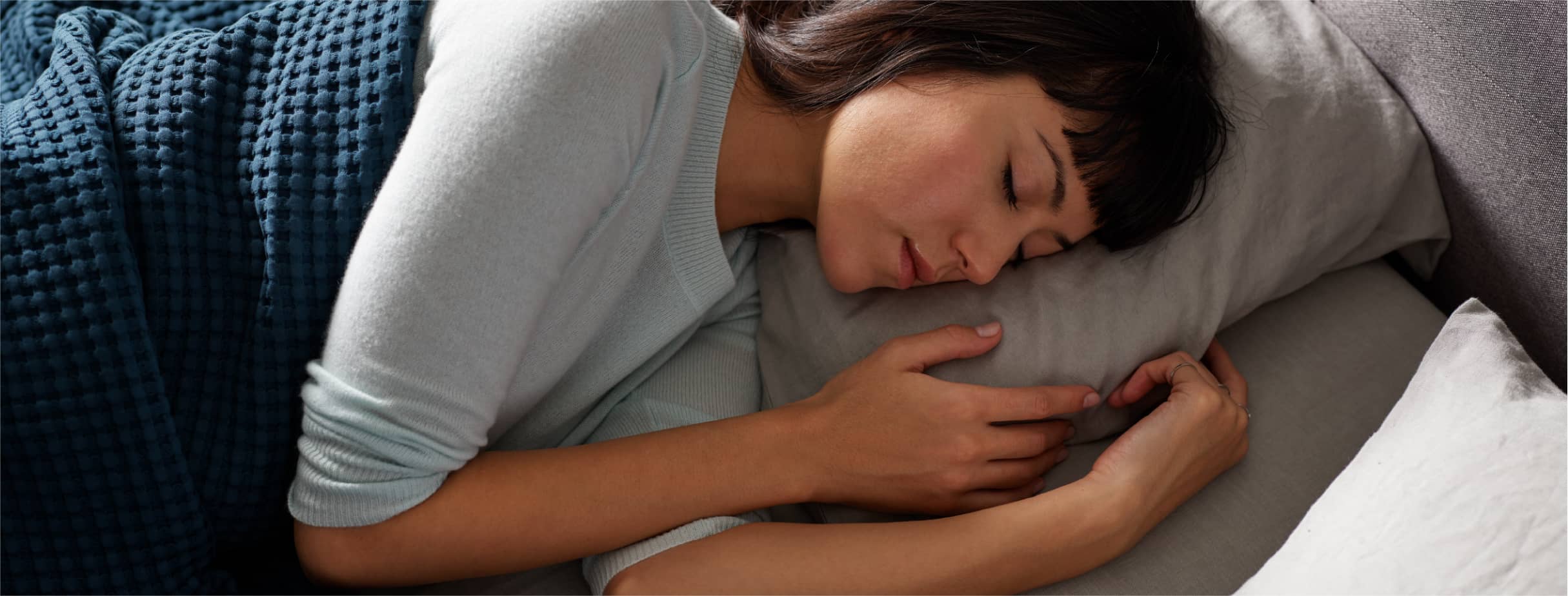 Woman sleeping on a Tempur-Pedic® mattress