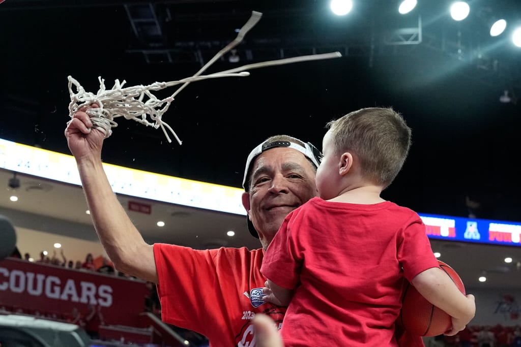 Mandatory Credit: Photo by Kevin M Cox/AP/Shutterstock (13790487y) Houston coach Kelvin Sampson cuts down the net while holding his grandson Kylen Sampson, in celebration of Houston winning the American Athletic Conference regular-season championship, following the team's NCAA college basketball game against Wichita State, in Houston Wichita St Basketball, Houston, United States - 02 Mar 2023