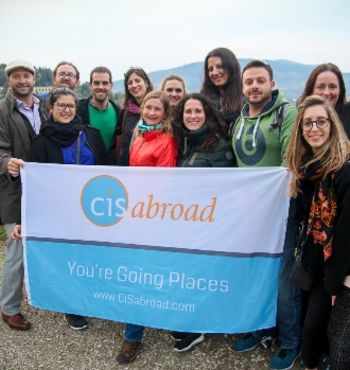 team poses with the CISabroad banner