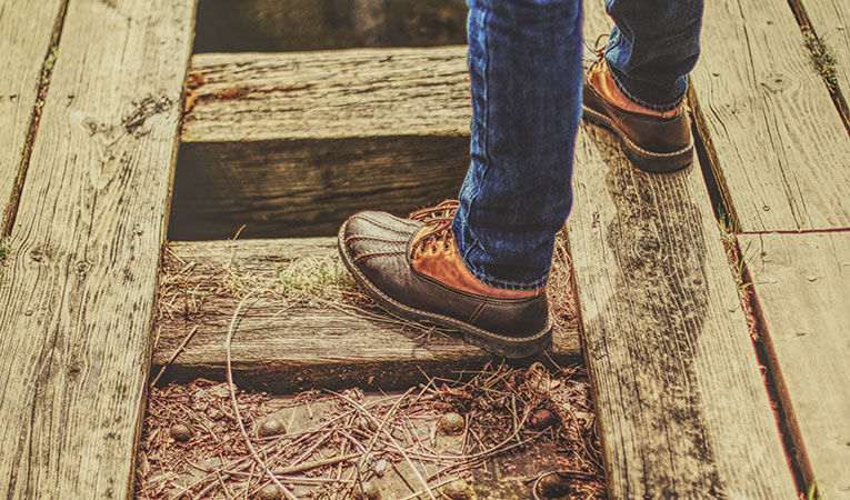 Person standing on railroad tracks