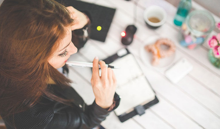 Girl thinking at desk picture