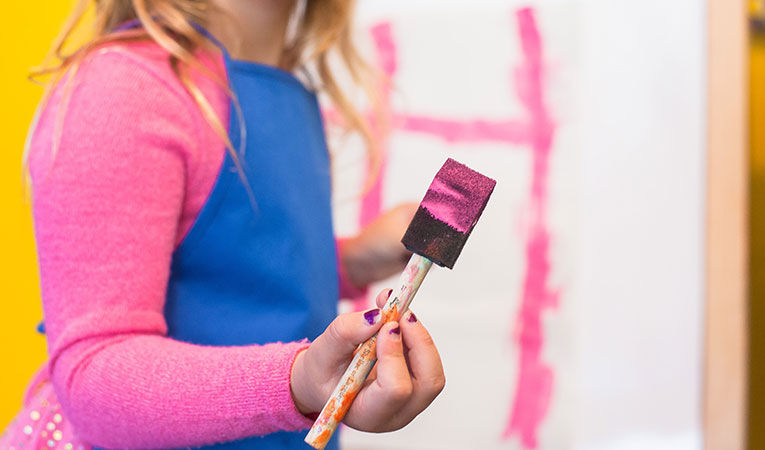 Girl at an English language camp in france painting