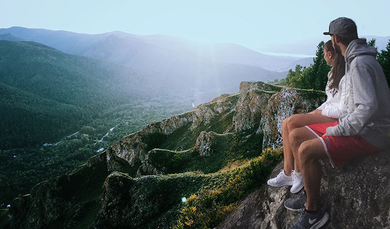 Man and woman perched exercising while studying abroad