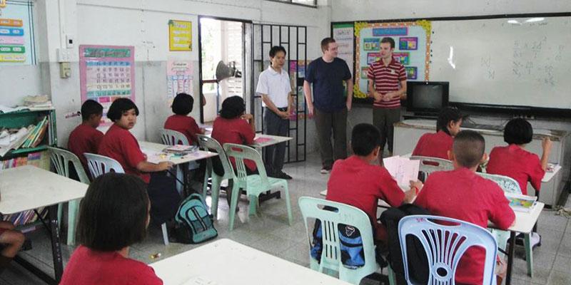 Foreign teacher in front of a class in Thailand