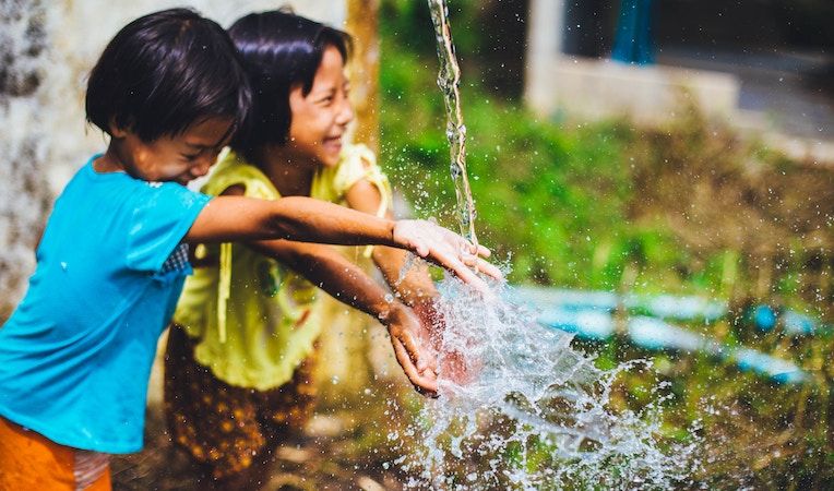 girls playing with water