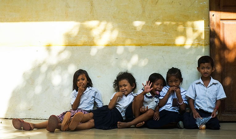 Group of young students hanging out in between classes