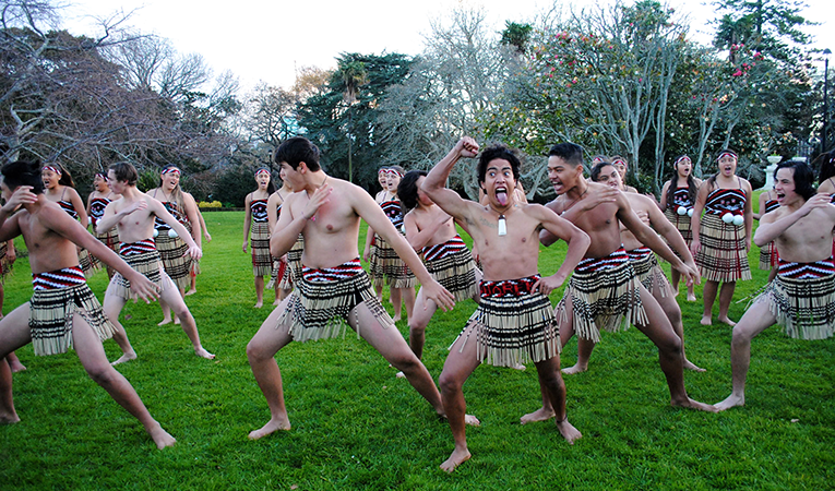 Young Maori show off a haka