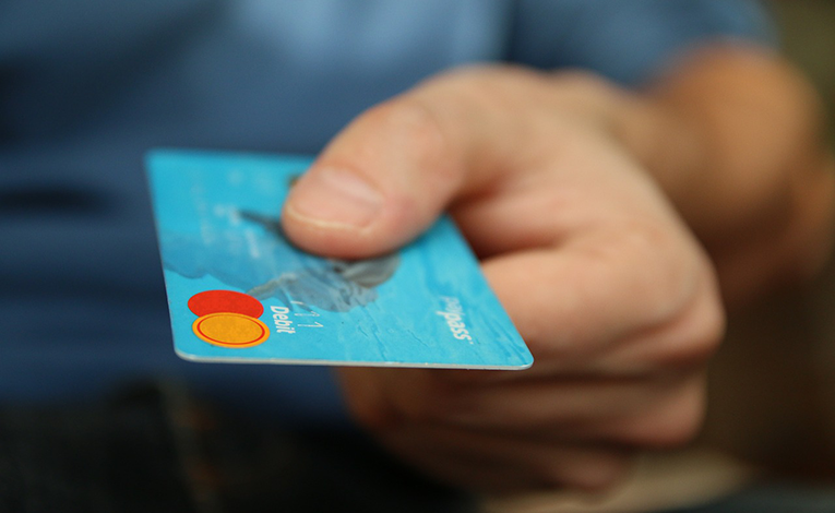Hand holding a credit card