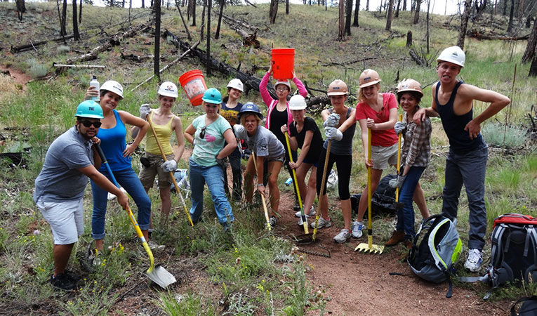 Volunteers with shovels ready to work.