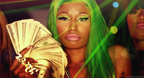 woman holding a wad of money