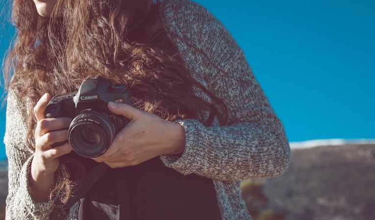 girl taking photos while studying in france