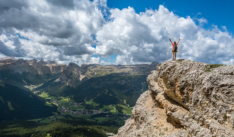 standing on top a mountain in Italy