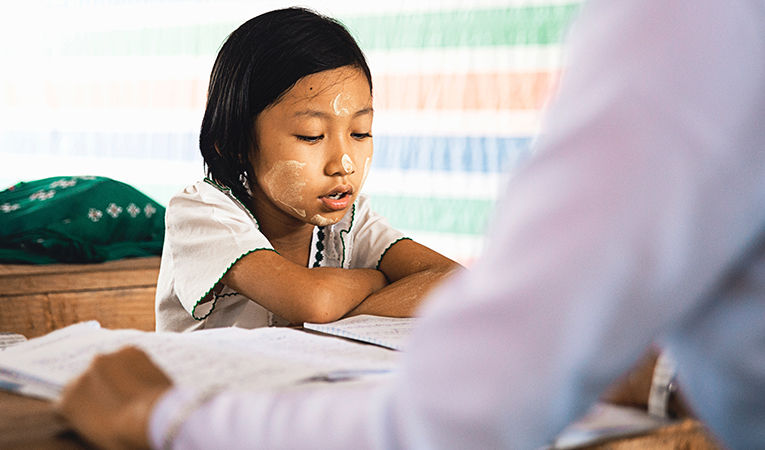 one-on-one work with student in Myanmar