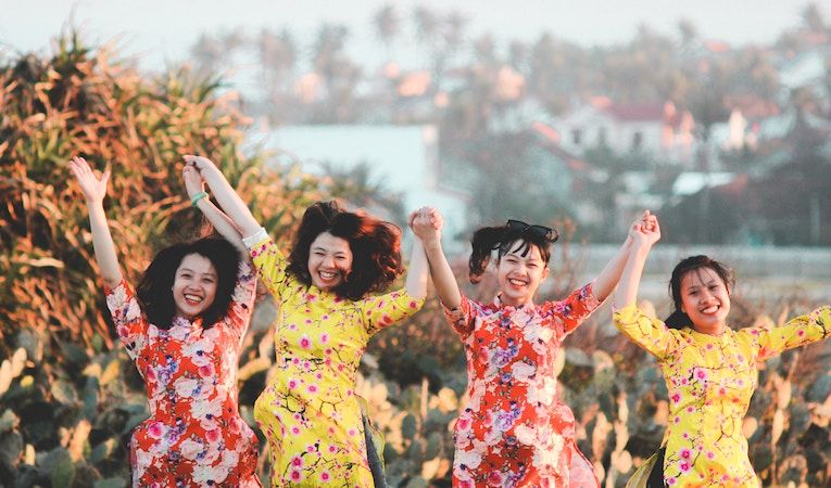 girls swinging arms in vietnam
