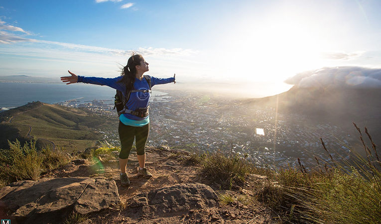 A volunteer enjoying the mountain top view