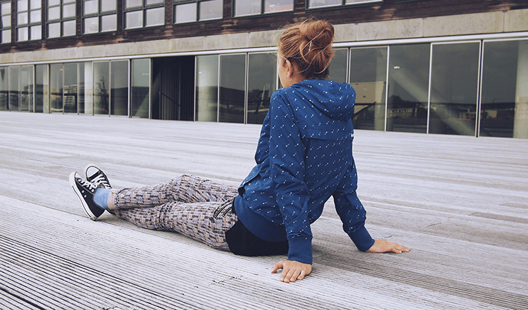 blond girl sitting outside of high school