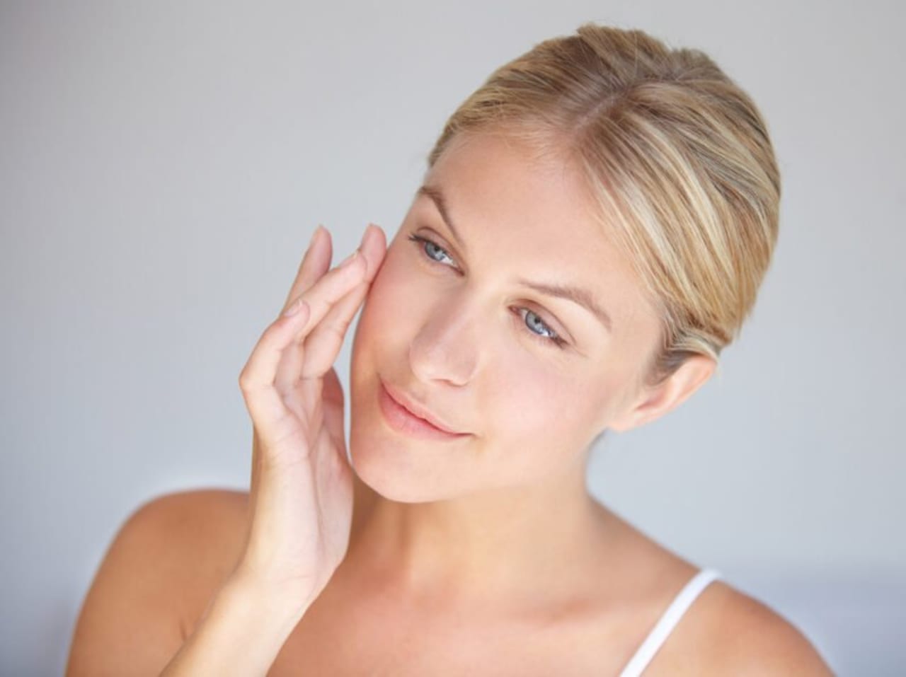 Woman considers different brands of fillers for different parts of face