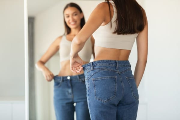 Woman trying on jeans