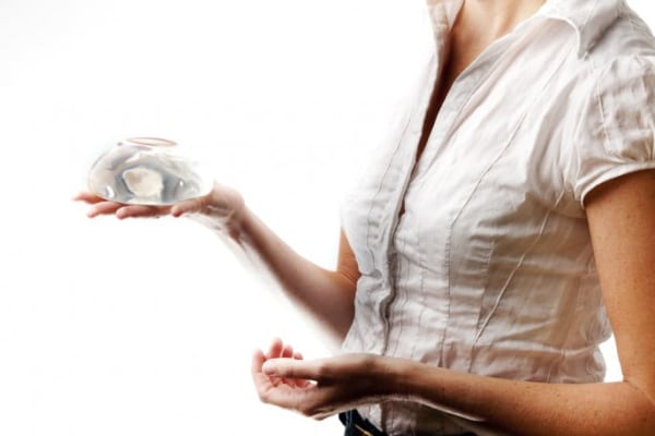 Woman considering breast augmentation options