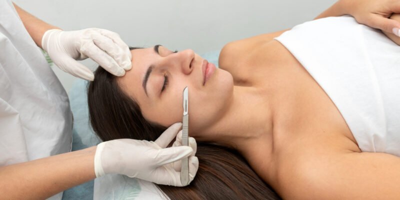 Woman getting a dermaplaning skin treatment at a med spa