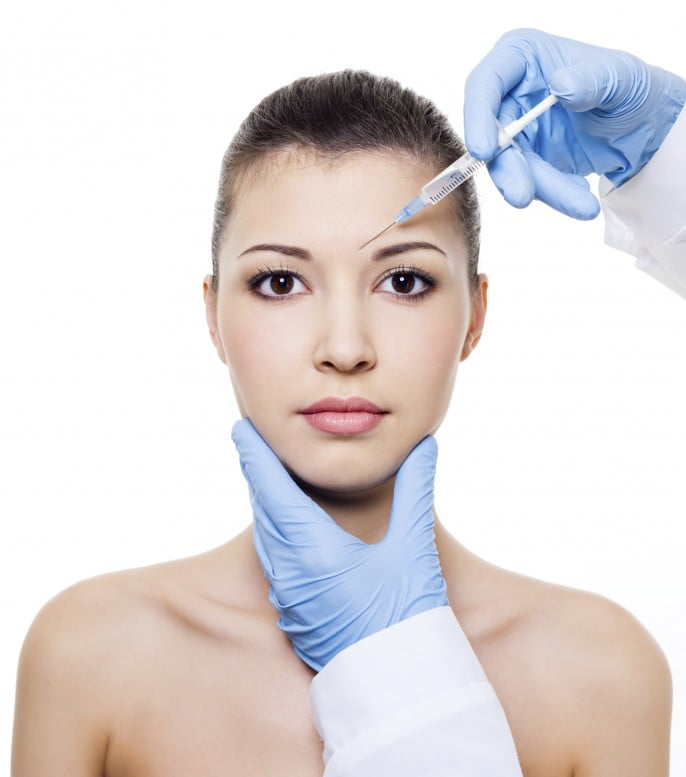 Woman receives injectable Botox treatment