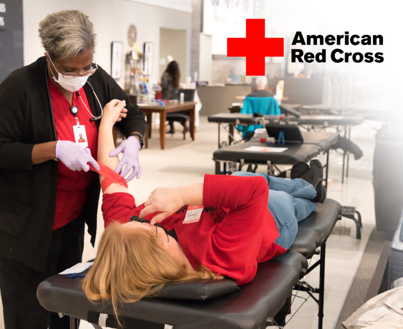 Woman giving blood at Gardner-White Blood Drive