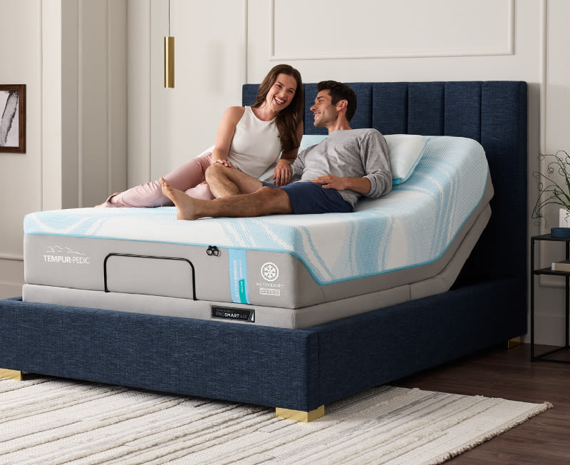 Couple relaxing on a Tempur ActiveBreeze bed