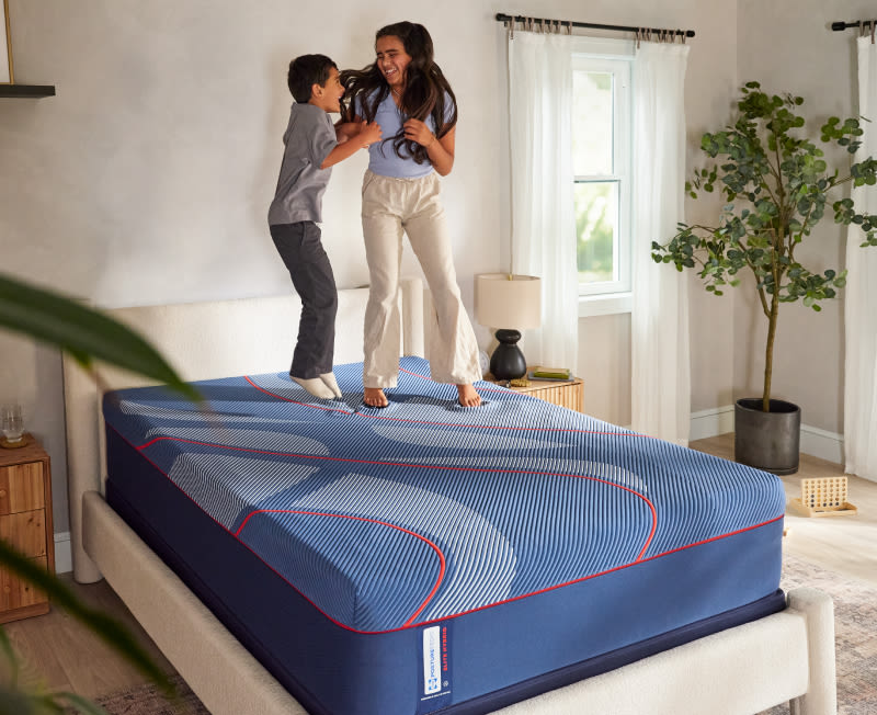 Kids jumping on a mattress