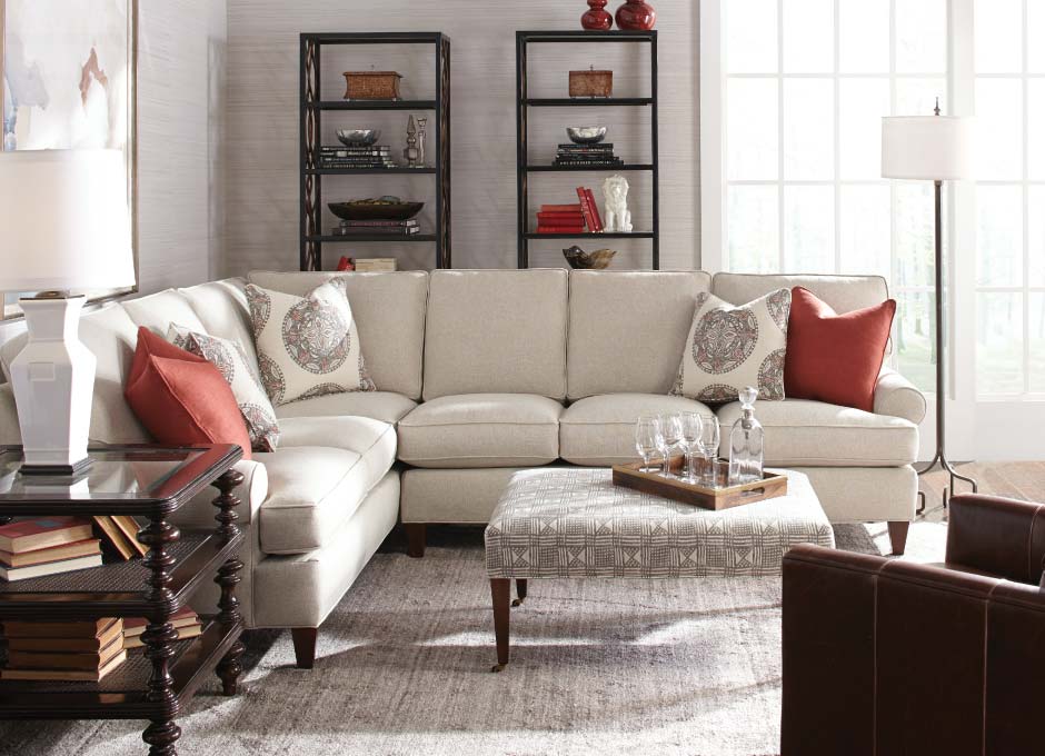 White couch with white and red throw pillows