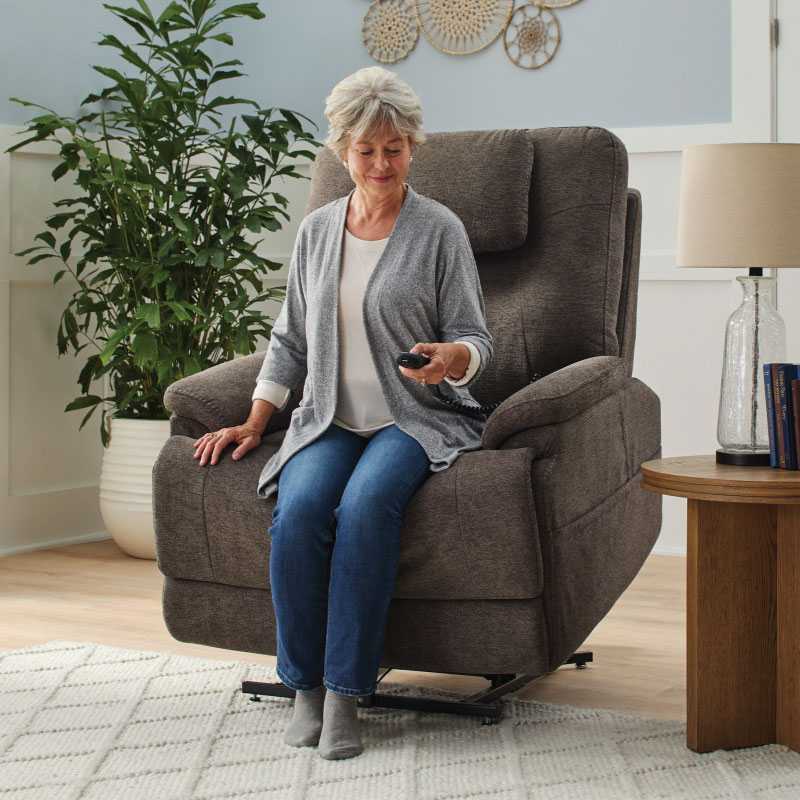 Woman exiting a power recliner