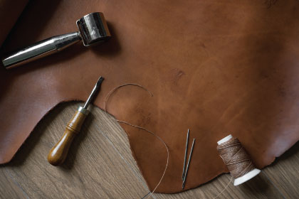 Man repairing a damaged chair.