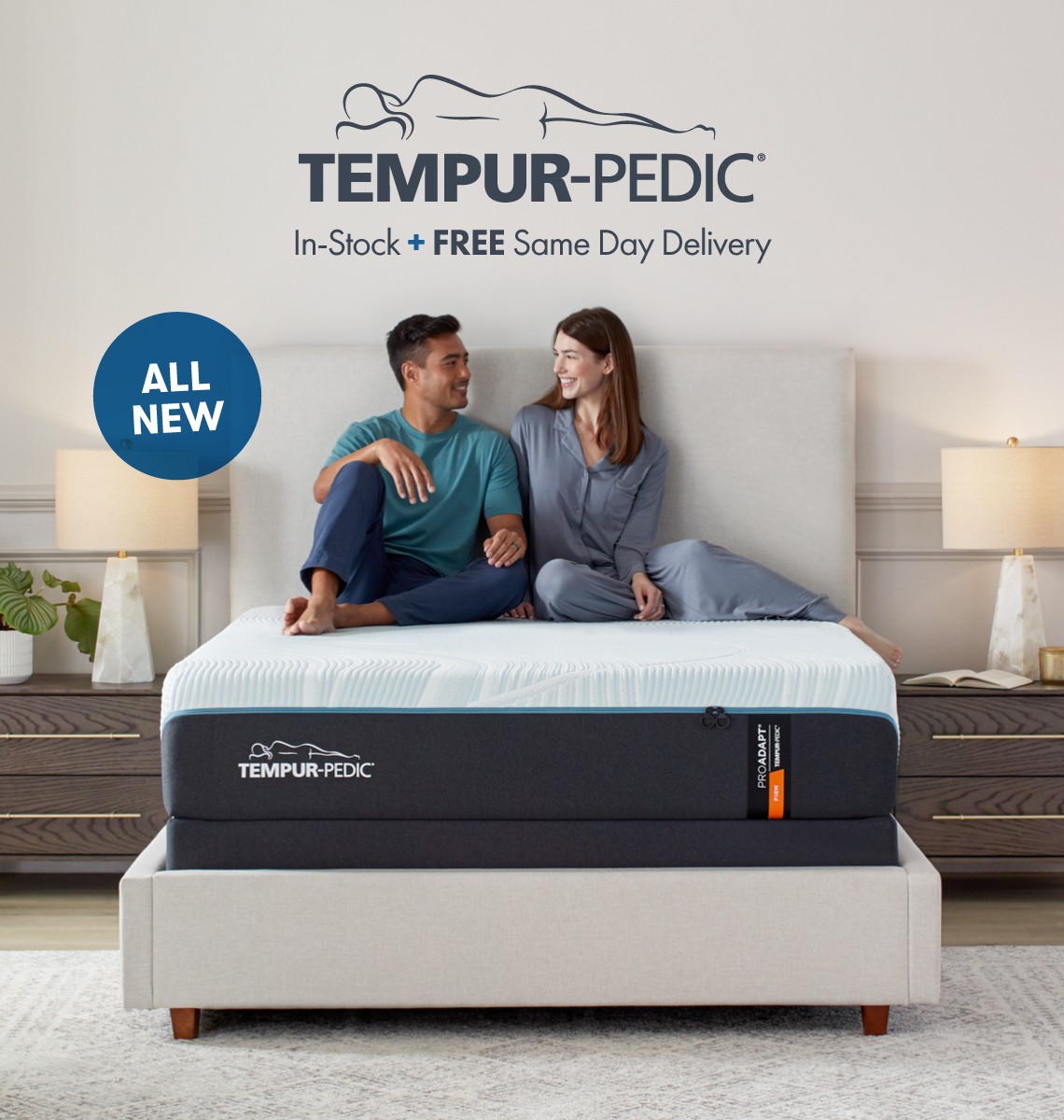 Tempur Pedic queen size mattress in a bedroom with a coupe sitting atop the bed.