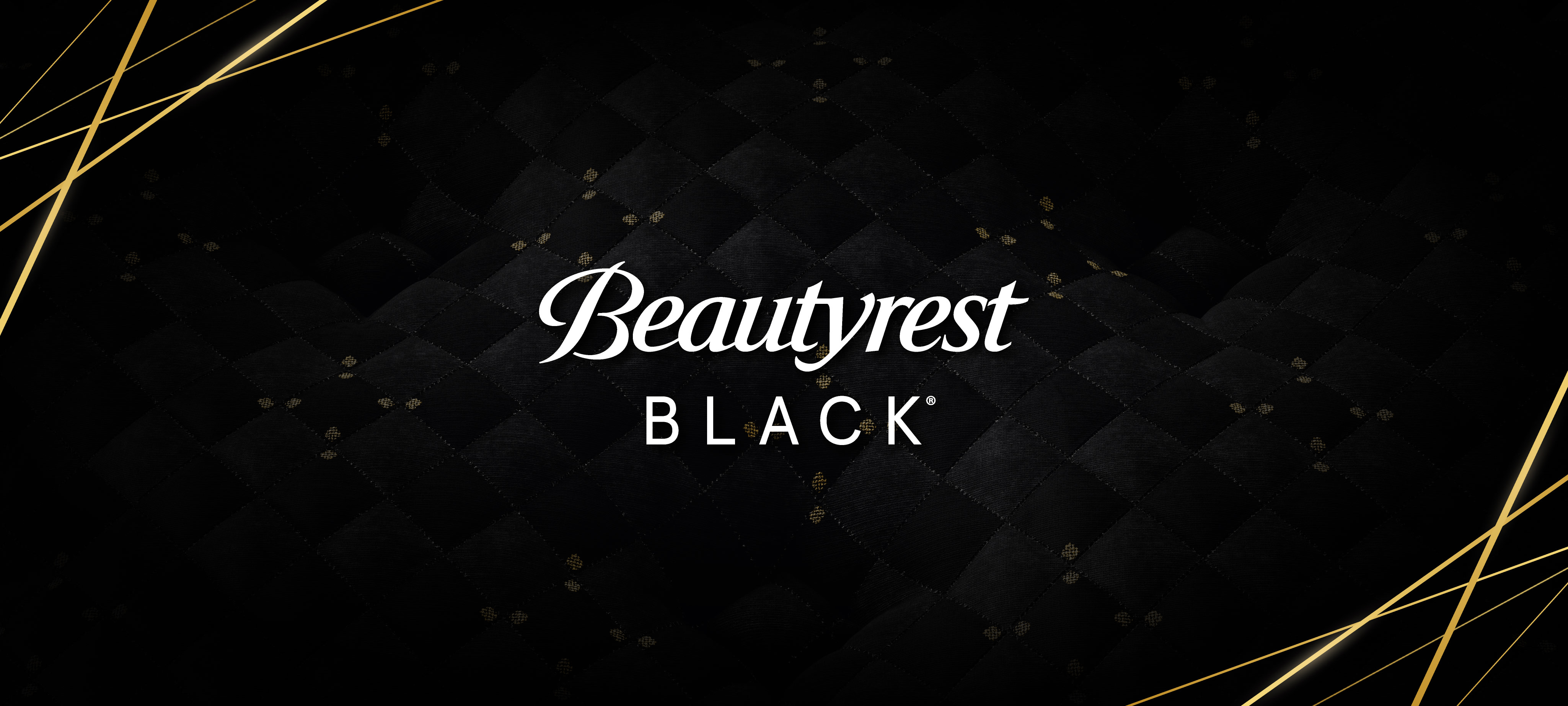 A closeup image of the black cloth with gold detailing on the top of Beautyrest Black mattresses. The Beautyrest Black logo is overlaid on the image.