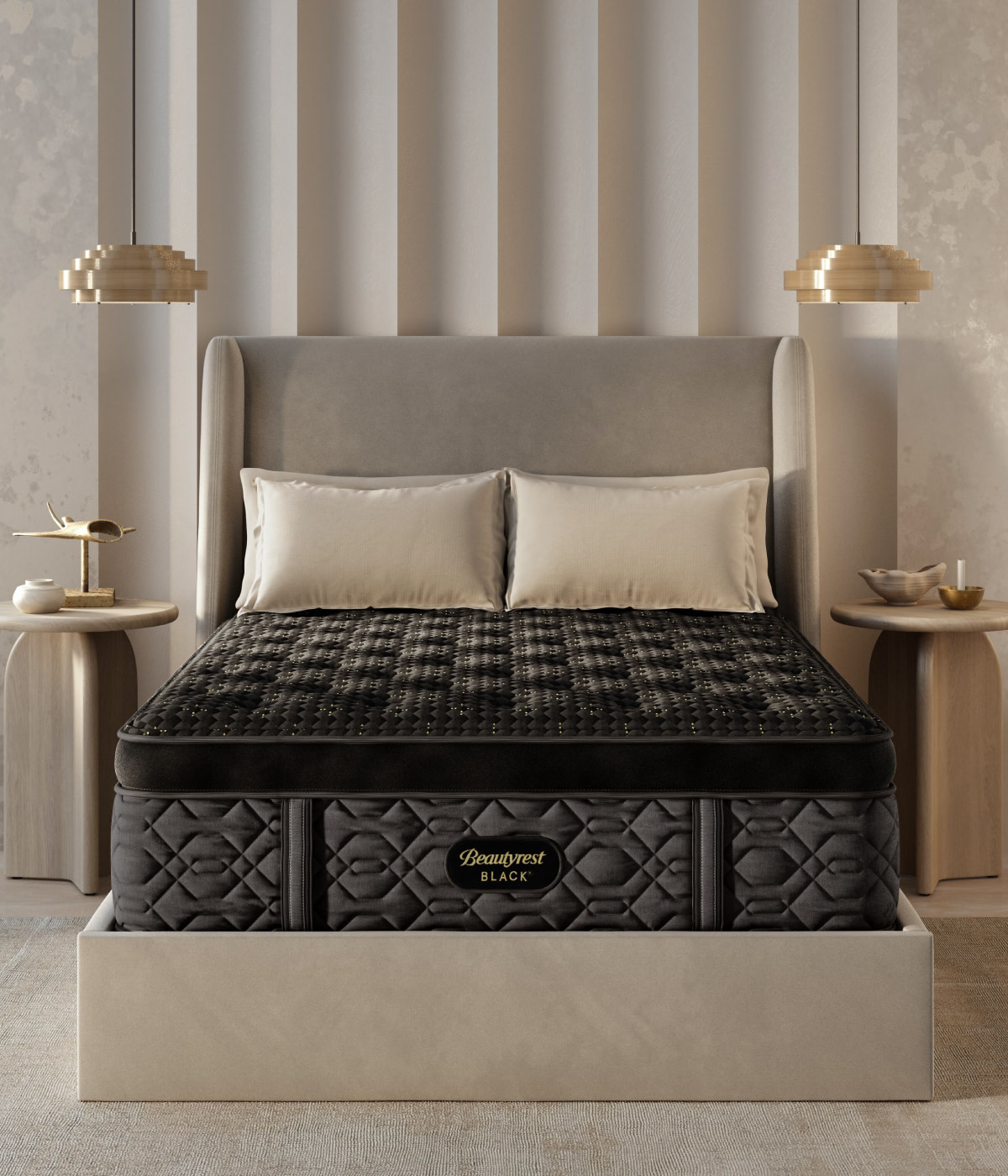 A Beautyrest Black queen size pillow top mattress on a bed with four pillows, two nightstands, and a tan rug in a bedroom.