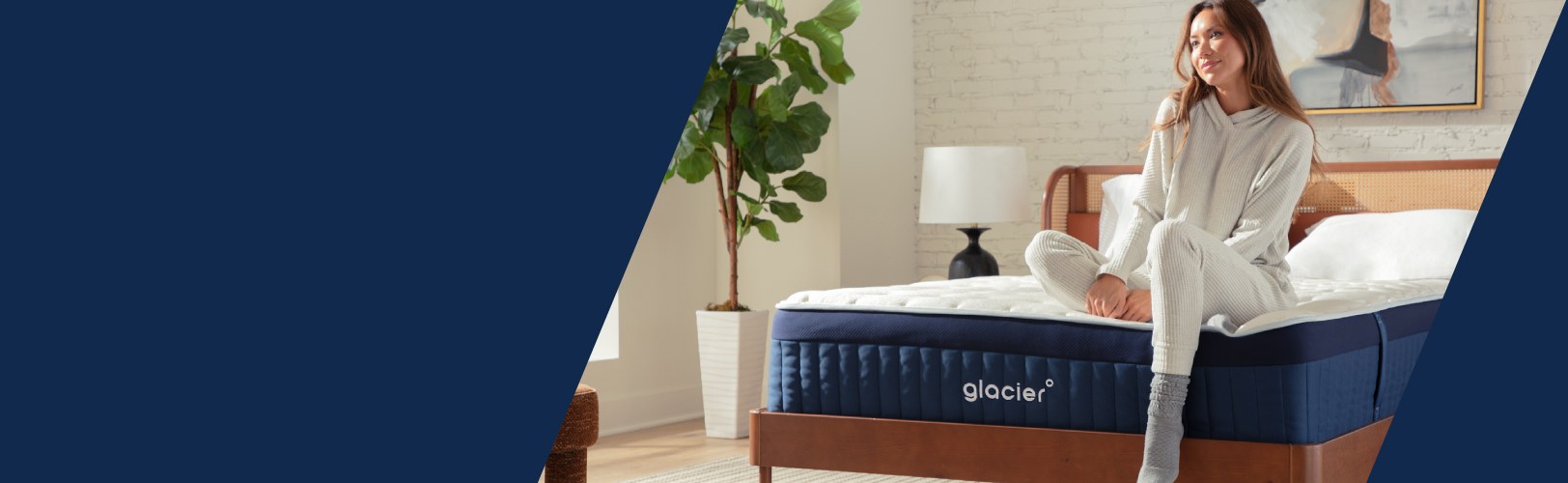 Woman sitting on a Glacier mattress.