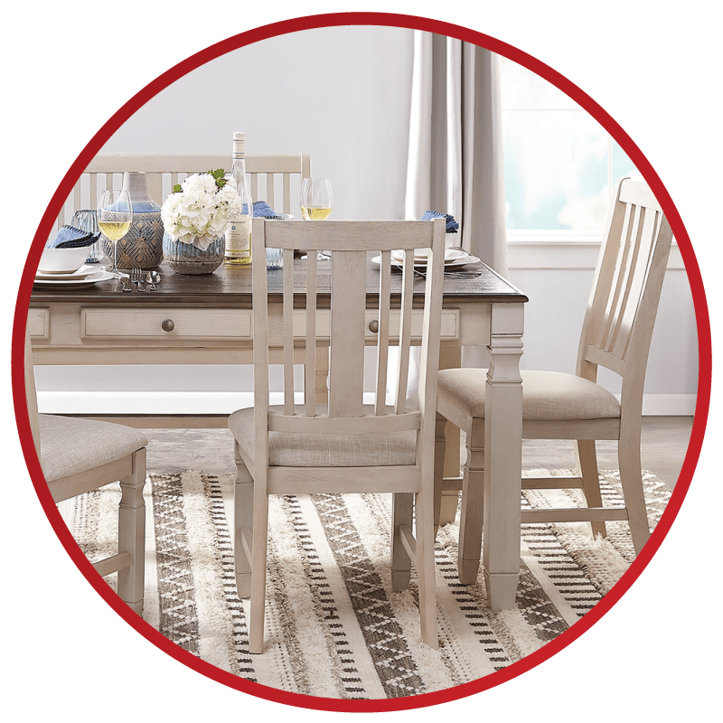 A dining table surrounded by chairs.