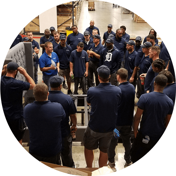 Employees meeting in a warehouse